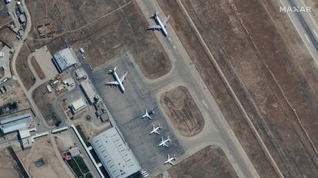 Six commercial airplanes are seen near the main terminal of the Mazar-i-Sharif airport, in northern Afghanistan, September 3 2021.