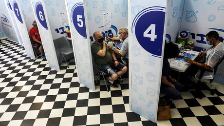 Israelis receive their third shot of Covid-19 vaccine in Rishon Lezion, Israel, August 24, 2021