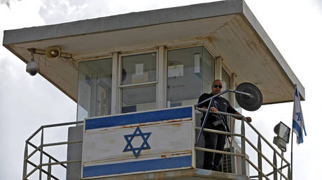 A police officer keeps watch from an observation tower at the Gilboa Prison in northern Israel on September 6, 2021.