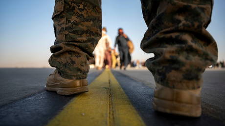 A US Marine provides security during evacuation at the Hamid Karzai International Airport in Kabul. © Reuters /  US Air Force