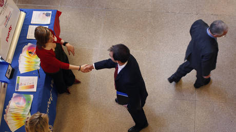 FILE PHOTO: Job seekers are shown at a Rutgers University employment fair in pre-pandemic times.