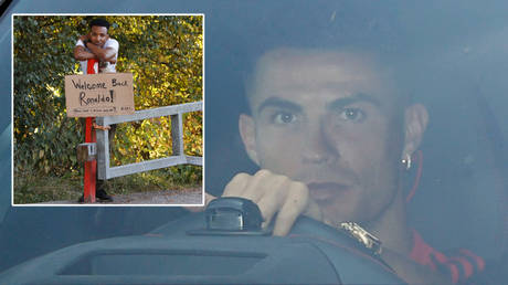 Cristiano Ronaldo drove past a superfan on his way to Manchester United training © Phil Noble / Reuters
