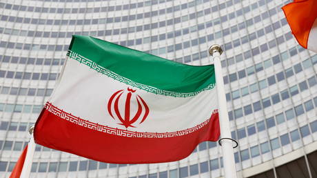 The Iranian flag waves in front of the International Atomic Energy Agency (IAEA) headquarters, in Vienna