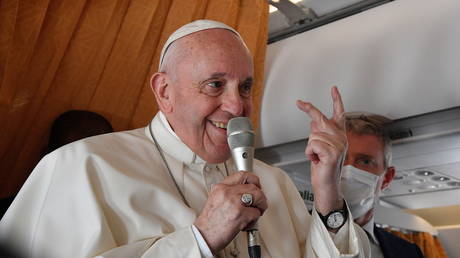 Pope Francis is shown speaking to reporters on Wednesday on his flight back to Rome from Bratislava.