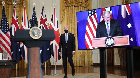 US President Joe Biden walks to the podium before his remarks on a National Security Initiative virtually with Australian Prime Minister Scott Morrison and British Prime Minister Boris Johnson, inside the East Room at the White House in Washington, US (FILE PHOTO) © REUTERS/Tom Brenner