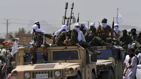 Taliban fighters atop Humvee vehicles parade along a road to celebrate after the US pulled all its troops out of Afghanistan, in Kandahar on September 1, 2021 following the Taliban’s military takeover of the country. © JAVED TANVEER / AFP