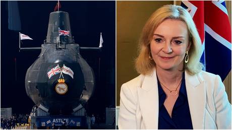 THe HMS Astute nuclear-powered submarine is launched at the Devonshire Dock Hall in Barrow-in-Furness, northwest England. © Reuters / Kieran Doherty; British Foreign Secretary Liz Truss © Reuters / Pedja Stanisic