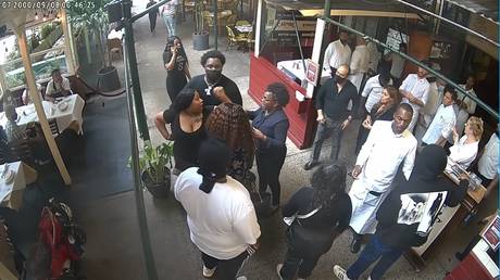 Surveillance video outside Carmine's restaurant in New York City shows customers attacking a hostess enforcing the vaccine passport mandate, September 17, 2021