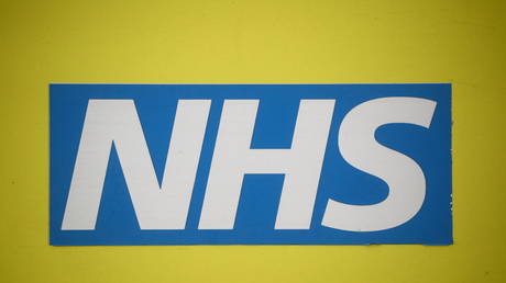 An NHS logo is seen on an ambulance