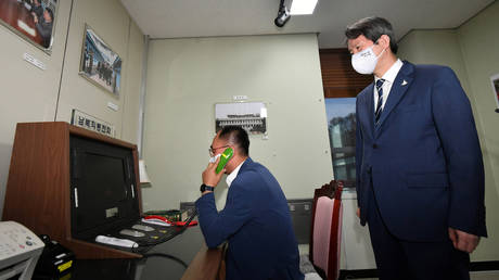 FILE PHOTO: South Korean Unification Minister Lee In-young inspects the inter-Korean hotline, September 16, 2020
