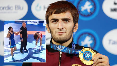 Top of the world: Russian wrestler beats American rival who had hammered previous opponents 41-0 to win finals gold (VIDEO)