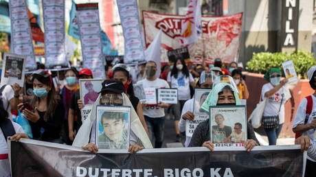 FILE PHOTO: Relatives of drug war victims march towards the presidential Malacanang Palace in Manila, Philippines, on June 30, 2021.