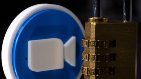 A 3D printed Zoom logo is seen behind a padlock in this illustration picture taken May 4, 2021. © REUTERS/Dado Ruvic