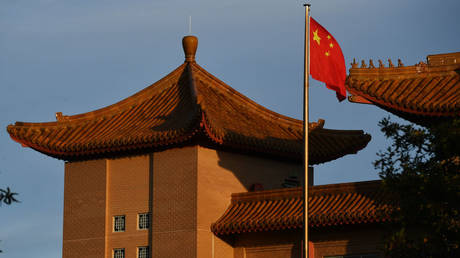 A Chinese flag flies at the Embassy of the People's Republic of China on May 12, 2020 in Canberra, Australia