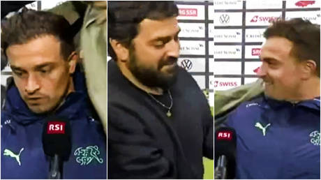 Xherdan Shaqiri was unexpectedly draped in a coat during a post-match interview © Twitter / StefanInKosovo