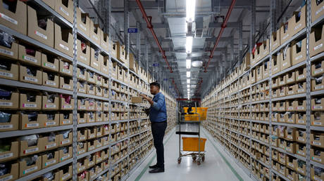 FILE PHOTO: An employee works at an Amazon Fulfillment Centre on the outskirts of Bengaluru, India, on September 18, 2018.