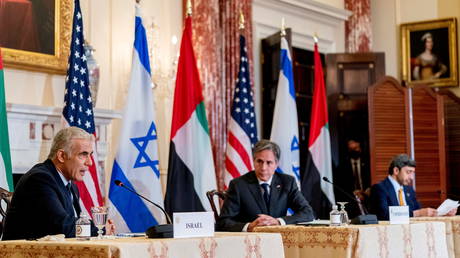 Israeli Foreign Minister Yair Lapid, accompanied by US Secretary of State Antony Blinken, and United Arab Emirates Foreign Minister Sheikh Abdullah bin Zayed al-Nahyanin, speaks at a press conference in Washington, October 13, 2021.