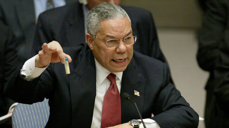 FILE PHOTO. Former U.S. Secretary of State Colin Powell holds up a vial that he described as one that could contain anthrax, during his presentation on [Iraq] to the U.N. Security Council, in New York February 5, 2003. © Reuters / Ray Stubblebine