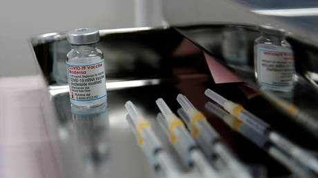 FILE PHOTO: A vial containing doses of the Moderna vaccine against the coronavirus disease (COVID-19) and syringes are pictured at Japan Airlines (JAL) facility where its staff receive the vaccines at Haneda airport in Tokyo, Japan June 14, 2021. © Reuters / Kim Kyung-Hoon
