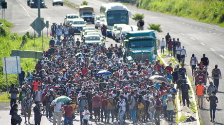 Migrants and asylum seekers walk in a caravan heading to US border, in Tapachula, Mexico