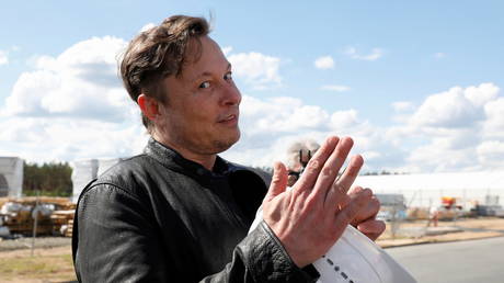 FILE PHOTO: Tesla CEO Elon Musk is shown on a May 2021 visit to a new factory site near Berlin.