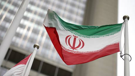 FILE PHOTO: Iranian flag flies in front of the UN office building, housing IAEA headquarters in Vienna, Austria, on May 24, 2021.