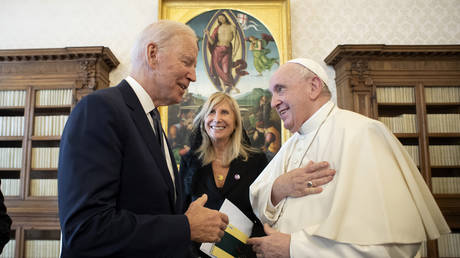 US President Joe Biden, left, talks to Pope Francis as they meet at the Vatican, Friday, Oct. 29, 2021