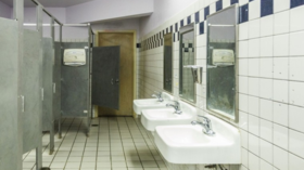 Parents sue to oust the chair of bathroom assault school board
