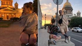 Internet model could face a year in jail as Russian cops probe raunchy butt photo shoot opposite iconic St. Petersburg cathedral