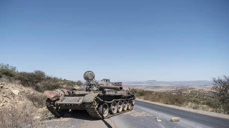 FILE PHOTO. A damaged tank stands on a road north of Mekele, the capital of Ethiopia's Tigray region.