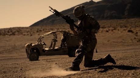 A British Royal Marine with Alpha Company, 40 Commando, reloads his weapon during Exercise Green Dagger at Twentynine Palms, California, October 10, 2021 (