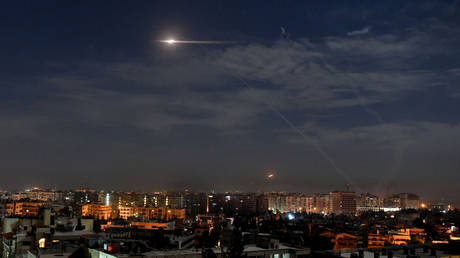 FILE PHOTO: Missile fire is seen over Damascus, Syria, January 21, 2019.