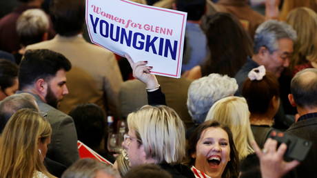 A supporter of nominee for Governor of Virginia Glenn Youngkin reacts as she waits for the results during an election night party at a hotel in Chantilly, Virginia, November 2, 2021.