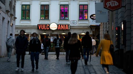 FILE PHOTO: People are seen milling outside a bar in Vienna, Austria, May 19, 2021.