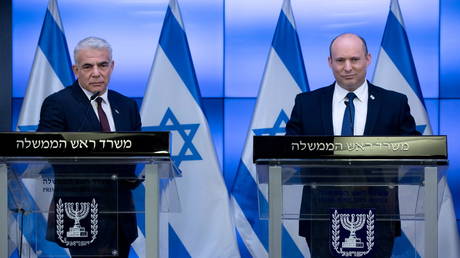 Israeli Prime Minister Naftali Bennett reacts during a news conference with Foreign Minister Yair Lapid in Jerusalem, on November 6, 2021.