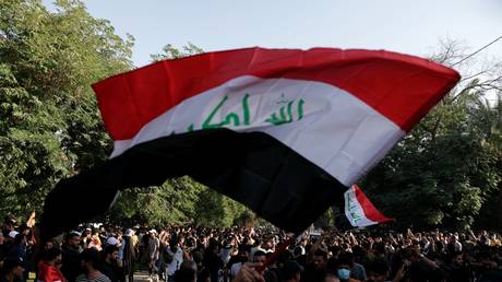 Protesters denounce election results and call for a manual recount of the parliamentary vote outside the Green Zone in Baghdad, Sunday, Oct. 31, 2021