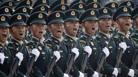Soldiers of People's Liberation Army (PLA) march in formation past Tiananmen Square during the military parade marking the 70th founding anniversary of People's Republic of China, on its National Day in Beijing, China October 1, 2019. © Reuters / Jason Lee