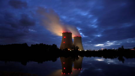 Steam rises from cooling towers of the Electricite de France (EDF) nuclear power plant in Belleville-sur-Loire, France, October 12, 2021