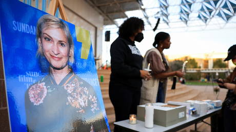 An image of cinematographer Halyna Hutchins, who died after being shot by Alec Baldwin on the set of his movie 'Rust,' is seen at a vigil in her honor in Albuquerque, New Mexico, October 23, 2021.
