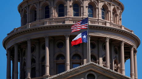 The U.S flag and the Texas State flag fly over the Texas State Capitol in Austin, Texas, U.S., March 14, 2017