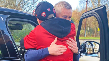 Ole Gunnar Solskjaer (right) hugged loyal supporter Luke Sellers on his way out of Manchester United © Twitter / lukesellers98