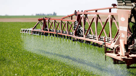 A tractor of the Poschinger Bray'sche Gueterverwaltung company applies liquid nitrogen fertilizer to a wheat field in Irlbach near Deggendorf, Germany, April 21, 2016.
