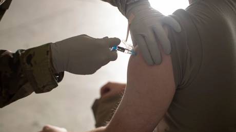 File photo: A US Air Force airman is vaccinated, Joint Base McGuire-Dix-Lakehurst, New Jersey, US, November 6, 2021.
