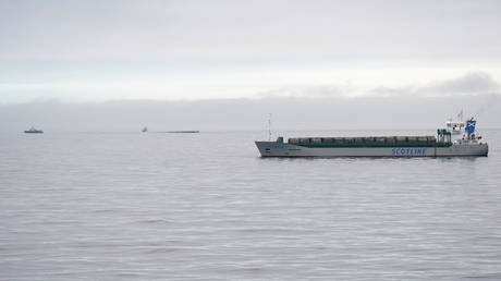 The British cargo ship Scot Carrier is seen at right after it collided with a Danish cargo ship Karin Hoej, seen capsized in the background. ©Johan Nilsson / TT via AP