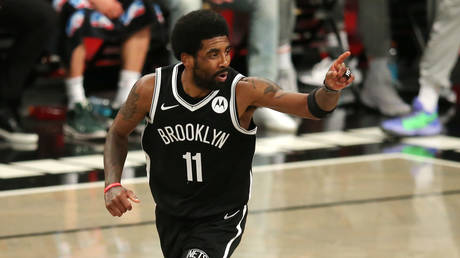 Brooklyn Nets point guard Kyrie Irving (11) reacts after making a basket against the Milwaukee Bucks, Brooklyn, New York, Jun 5, 2021