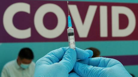 FILE PHOTO. A healthcare worker prepares a dose of Sputnik V at a vaccination center in Gostiny Dvor in Moscow, Russia on July 6, 2021.