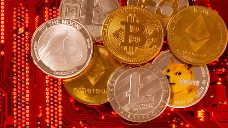 FILE PHOTO: FILE PHOTO: Representations of cryptocurrencies Bitcoin, Ethereum, DogeCoin, Ripple, Litecoin are placed on PC motherboard, June 29, 2021.