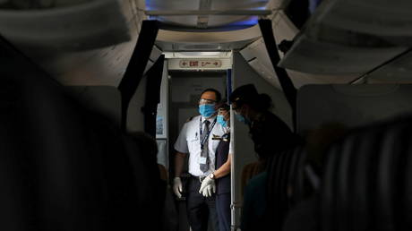 Dr Anthony Fauci and Joe Biden have issued warnings about wearing masks on planes © Mohamed Abd El Ghany / Reuters
