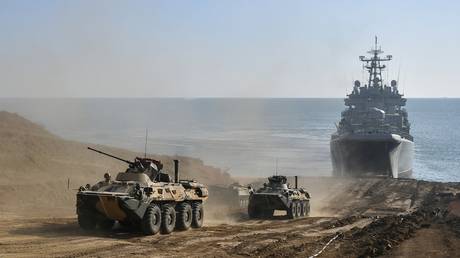 A BTR-82A armored personnel carrier lands from a large landing ship during an exercise in the amphibious landing on an unimproved shore held by army corps and naval infantry units of the Russian Black Sea Fleet at the Opuk range, in Crimea, Russia. © Sputnik / Konstantin Mihalchevskiy