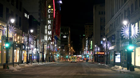 FILE PHOTO: St. Catherine Street, a major commercial area of downtown Montreal, on the first night after a curfew was imposed by the Quebec government, Canada, January 9, 2021.
